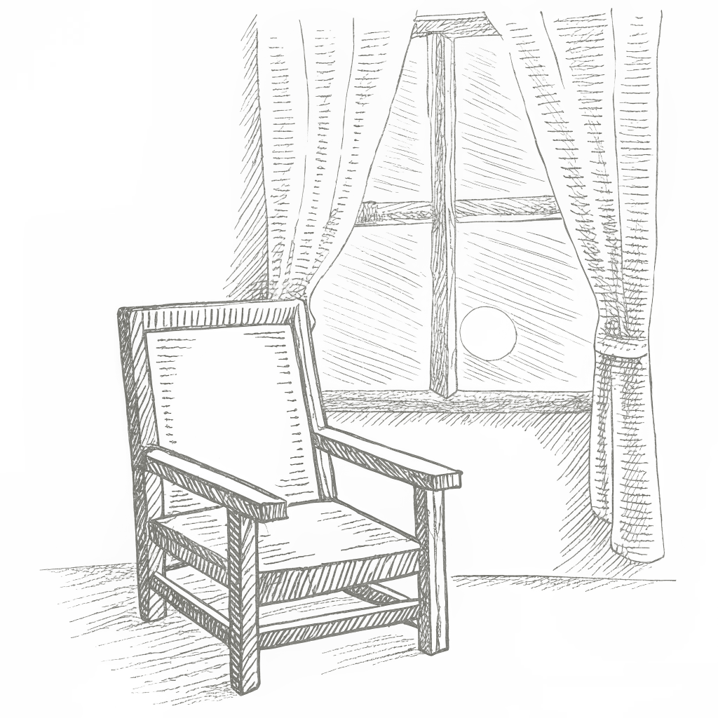 An armchair by a window at night — a quiet space to pray